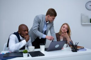 Three people in the middle of a meeting.